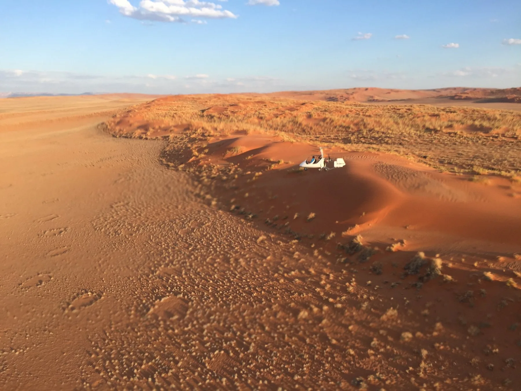 Gyroplane flying above the red dunes of Sossusvlei